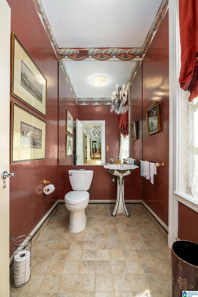 bathroom featuring toilet and tile patterned flooring