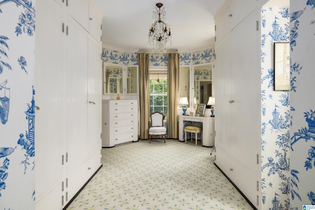 interior space with an inviting chandelier and crown molding