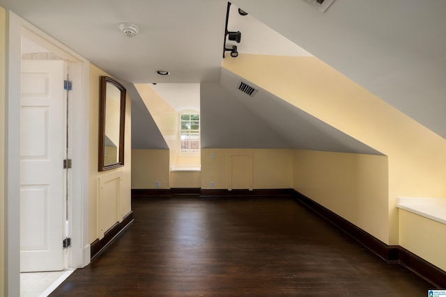 bonus room featuring dark wood-type flooring