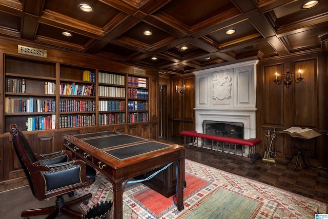 office featuring wooden walls, built in shelves, beam ceiling, and coffered ceiling