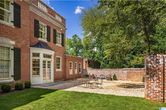 view of yard with french doors