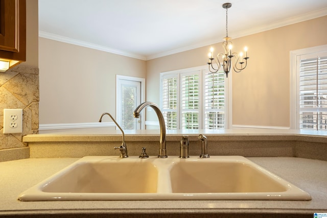 kitchen with sink, a chandelier, and hanging light fixtures