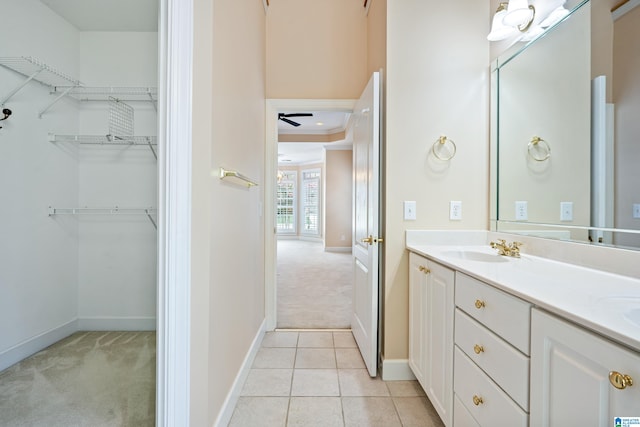 bathroom featuring dual vanity, tile patterned flooring, and ceiling fan