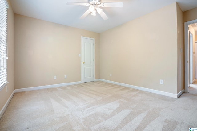 carpeted empty room with ceiling fan