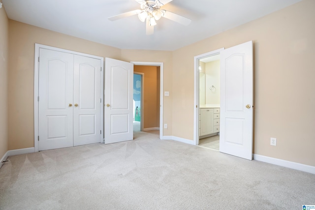 unfurnished bedroom featuring light carpet, ceiling fan, and a closet