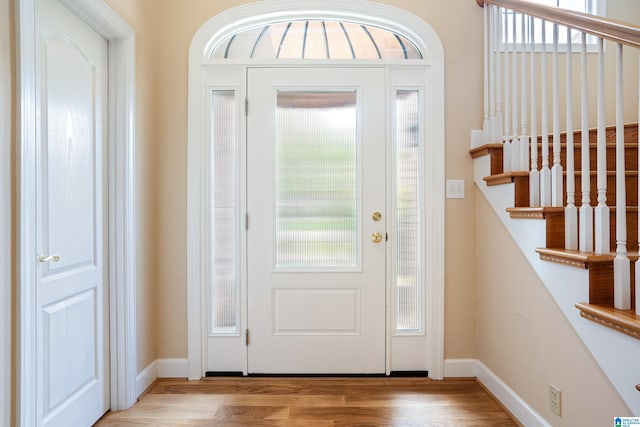 foyer entrance with light wood-type flooring