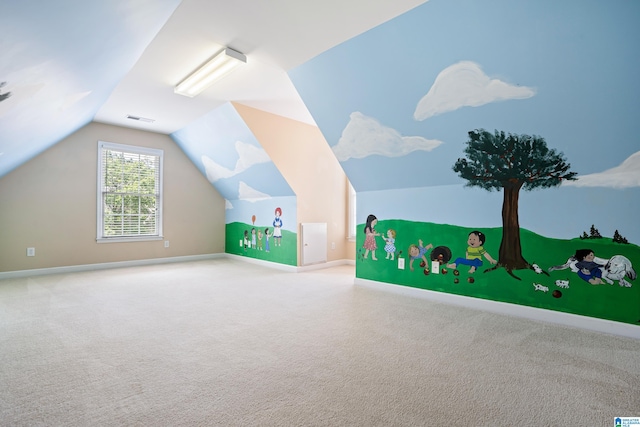 bonus room with vaulted ceiling and carpet