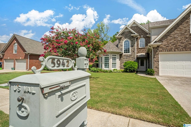 view of front facade with a garage and a front yard