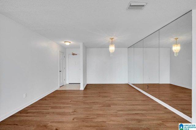 empty room with light wood-type flooring