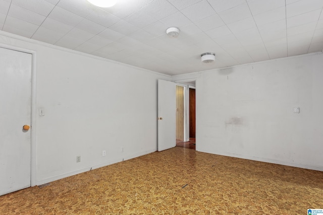 spare room featuring ornamental molding