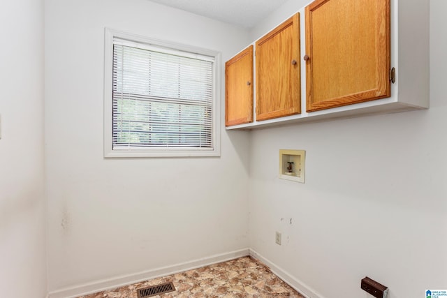 washroom featuring cabinets and hookup for a washing machine