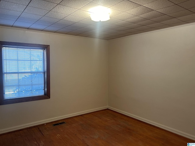 unfurnished room with hardwood / wood-style flooring