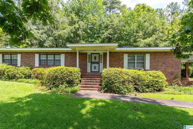 ranch-style home with a front yard