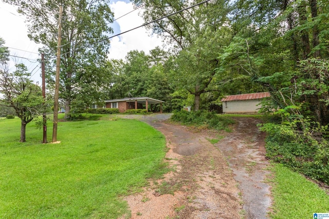 view of yard with a carport