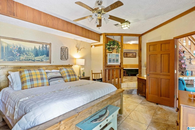 bedroom with ceiling fan, vaulted ceiling, a textured ceiling, and light tile patterned floors