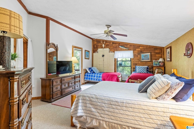 carpeted bedroom with ceiling fan, a textured ceiling, wooden walls, and lofted ceiling