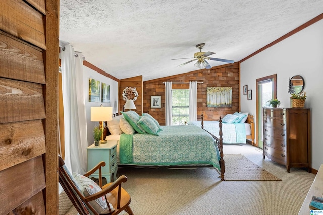 bedroom with ceiling fan, carpet flooring, vaulted ceiling, and multiple windows