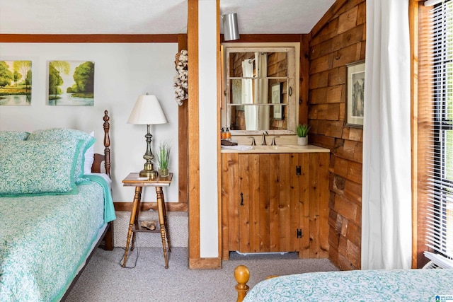 bedroom featuring wood walls, carpet flooring, vaulted ceiling, and multiple windows