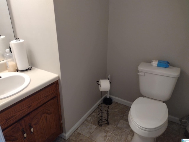 5315 Whisperwood Ct, Anniston, AL 36206 - bathroom with toilet, vanity, and baseboards