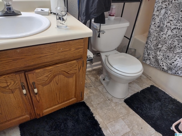 5315 Whisperwood Ct, Anniston, AL 36206 - bathroom featuring toilet, shower / tub combo with curtain, and vanity