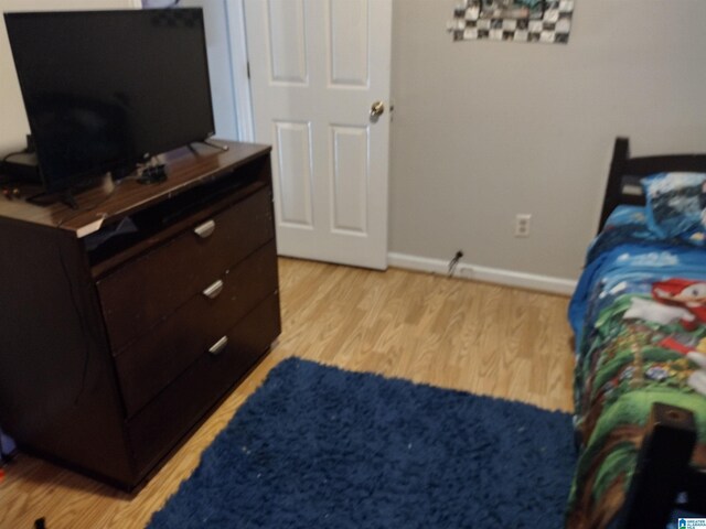 5315 Whisperwood Ct, Anniston, AL 36206 - bedroom featuring light wood-type flooring and baseboards