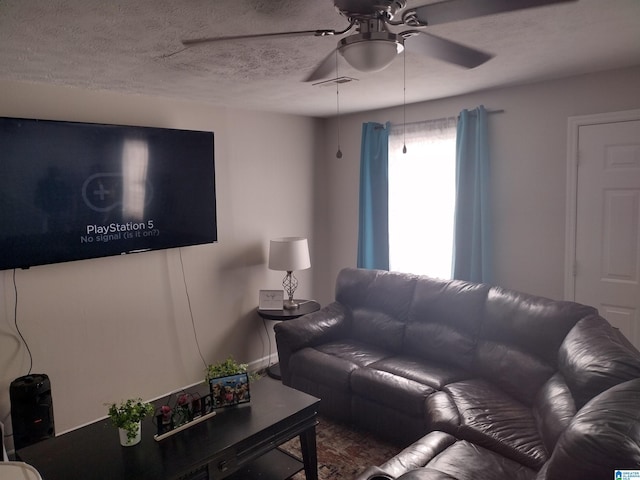 5315 Whisperwood Ct, Anniston, AL 36206 - living room with a ceiling fan and a textured ceiling