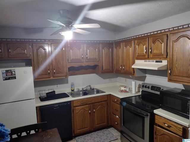 5315 Whisperwood Ct, Anniston, AL 36206 - kitchen with black appliances, a sink, under cabinet range hood, ceiling fan, and light countertops