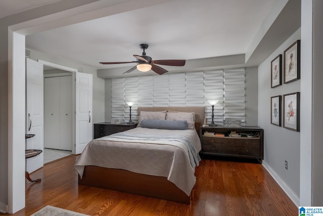 bedroom featuring hardwood / wood-style floors and ceiling fan