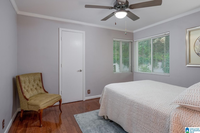 bedroom featuring ceiling fan, crown molding, and hardwood / wood-style flooring