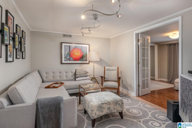 living room featuring crown molding and hardwood / wood-style floors