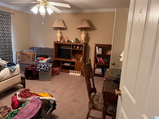 bedroom with ceiling fan, a textured ceiling, carpet, and ornamental molding