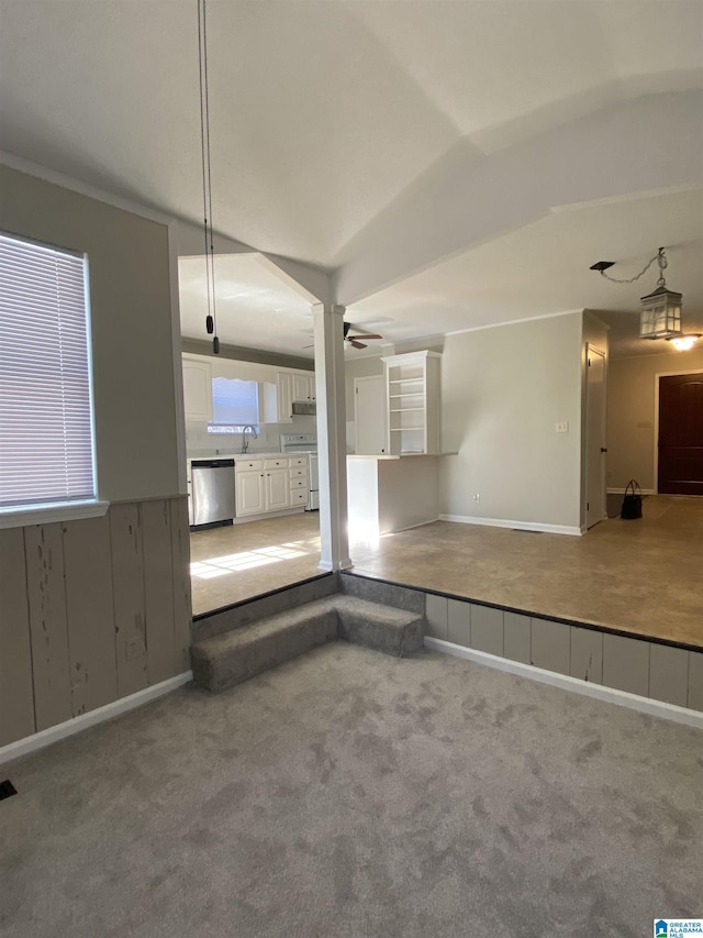 interior space with sink, vaulted ceiling, and ceiling fan