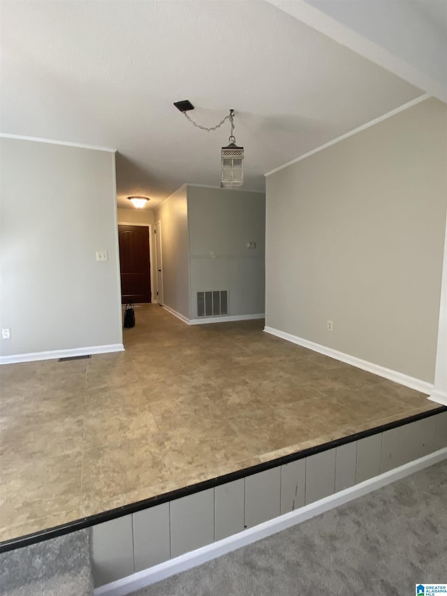 unfurnished living room with crown molding