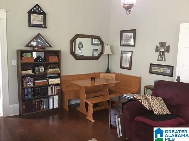 living area with dark wood-type flooring