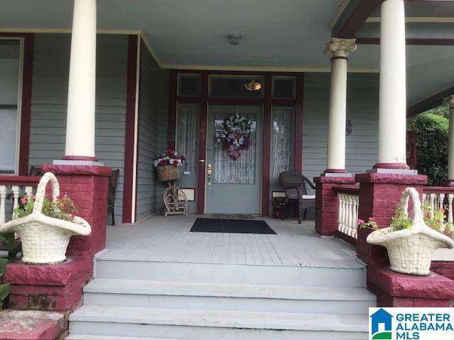 entrance to property featuring covered porch