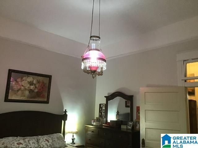 bedroom with a chandelier