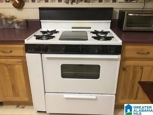 kitchen featuring white gas stove