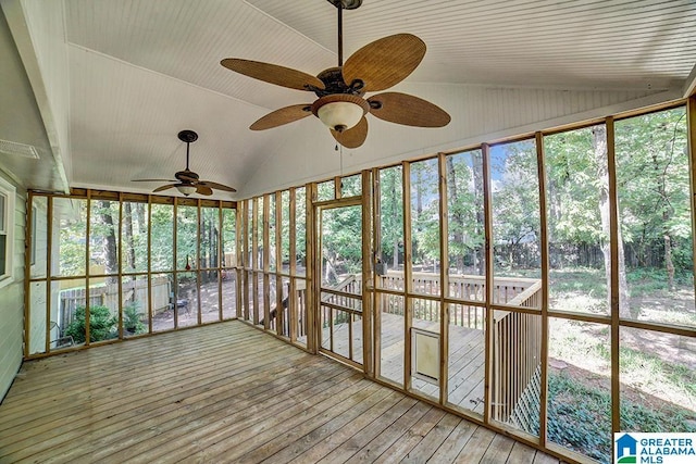 unfurnished sunroom featuring vaulted ceiling and ceiling fan