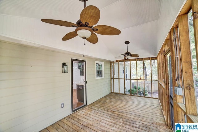 unfurnished sunroom with lofted ceiling