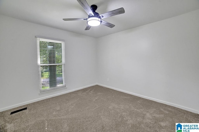 unfurnished room featuring a ceiling fan, carpet flooring, visible vents, and baseboards