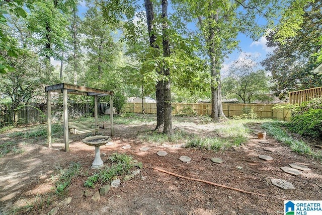 view of yard with a fenced backyard