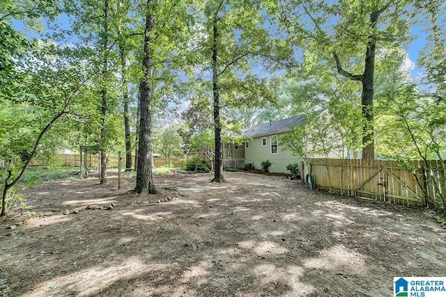 view of yard featuring a gate and fence