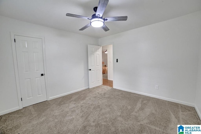 unfurnished bedroom with carpet floors, ceiling fan, and baseboards