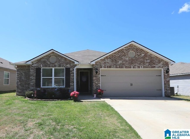 ranch-style home with a garage and a front yard