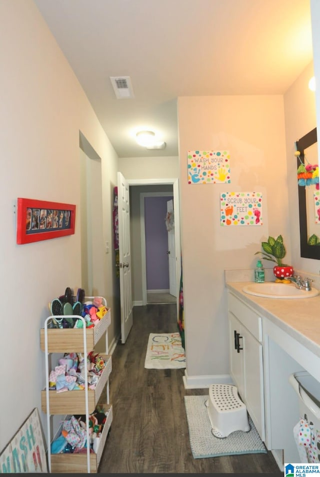 bathroom with wood-type flooring and vanity