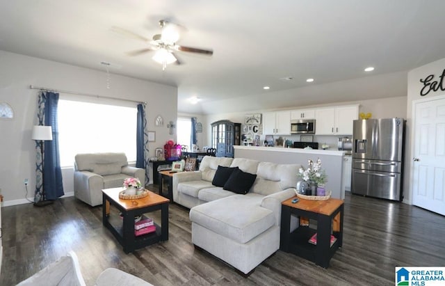 living room with dark hardwood / wood-style floors and ceiling fan