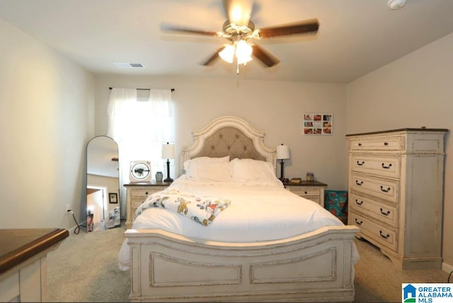 bedroom featuring ceiling fan and light colored carpet