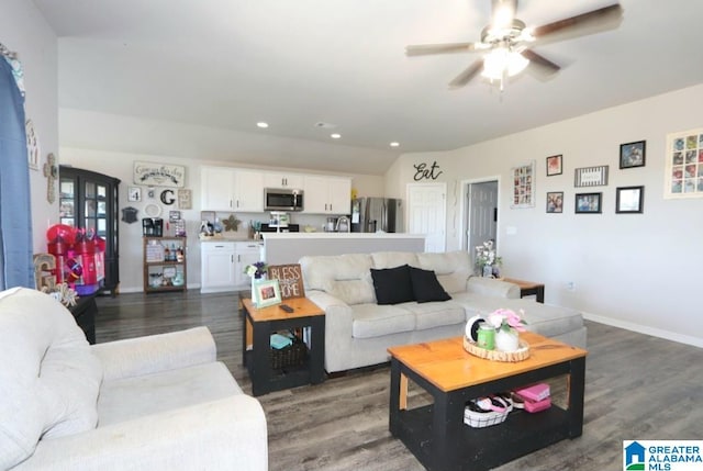 living room with ceiling fan and wood-type flooring