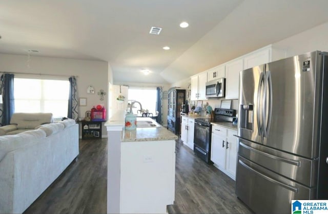 kitchen featuring white cabinetry, appliances with stainless steel finishes, sink, and dark hardwood / wood-style floors