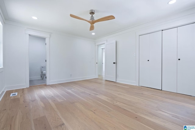 unfurnished bedroom featuring ornamental molding, light hardwood / wood-style flooring, connected bathroom, and ceiling fan